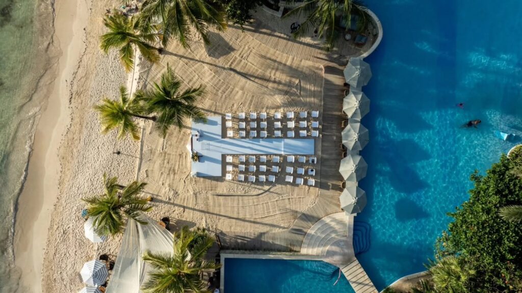Aerial view of a beach ceremony set up by MaxStage in Roatán