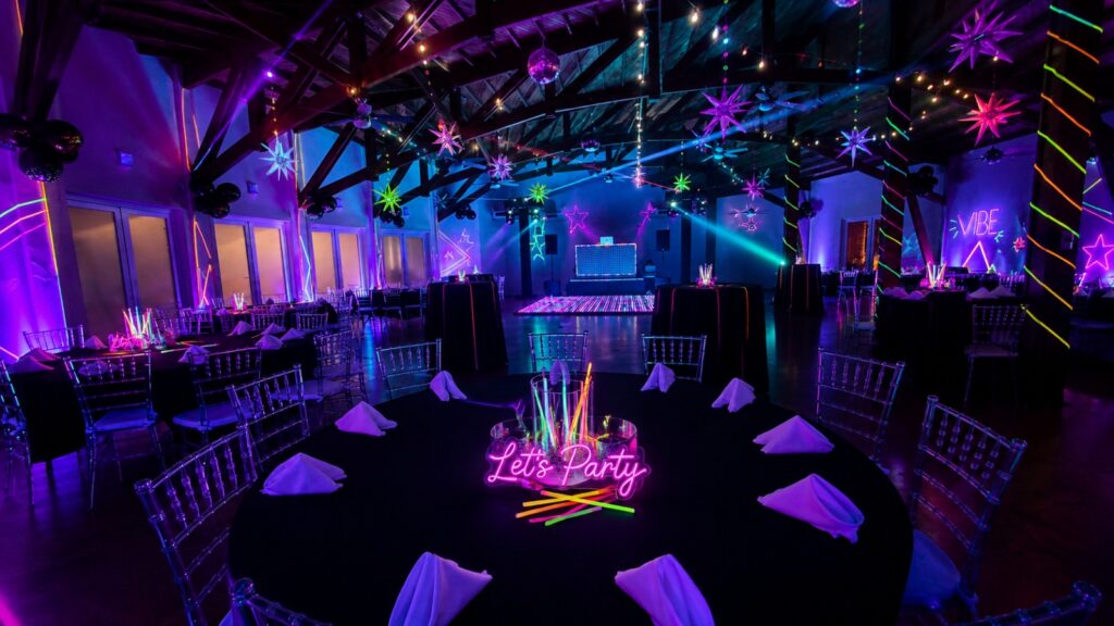 Private party with neon lighting and a dance floor